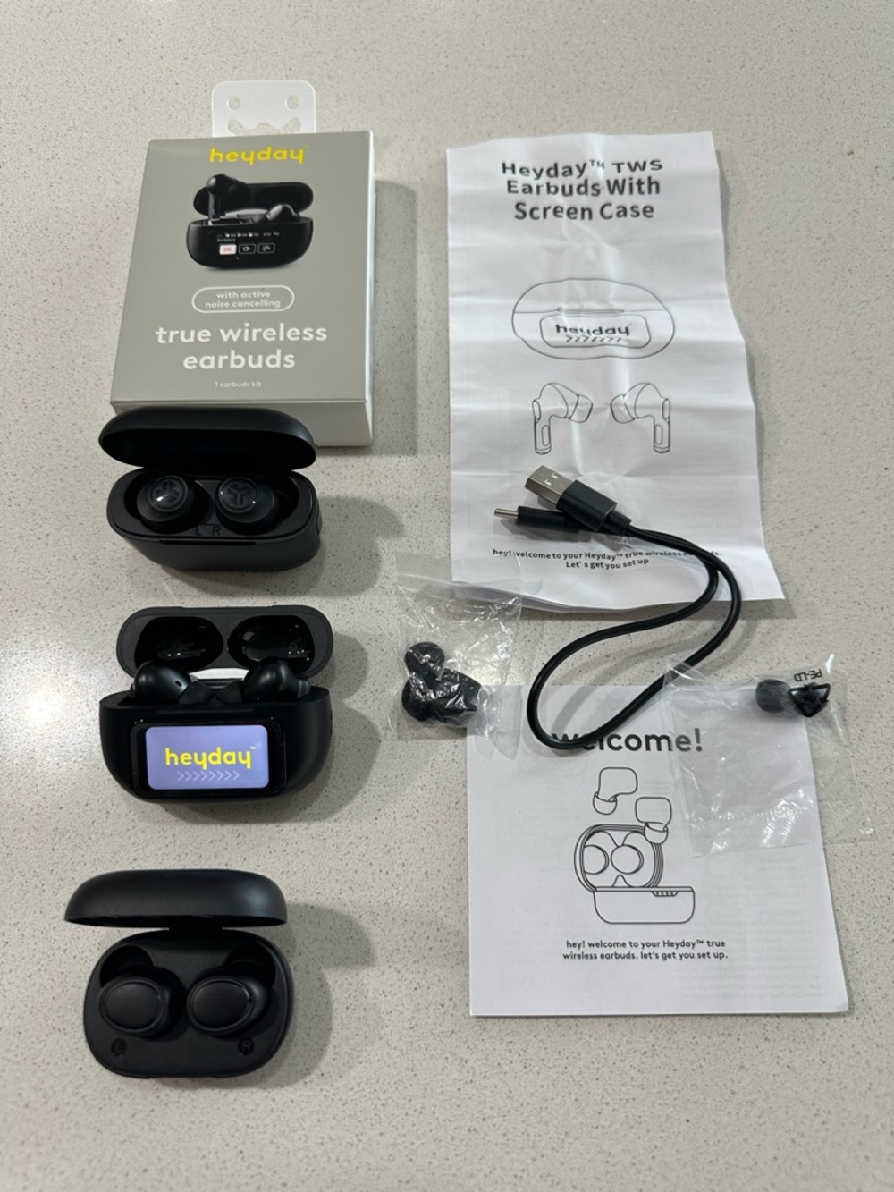 Set of 2 HeyDay True Wireless Earbuds and One JLab Earbuds- All Blacks.